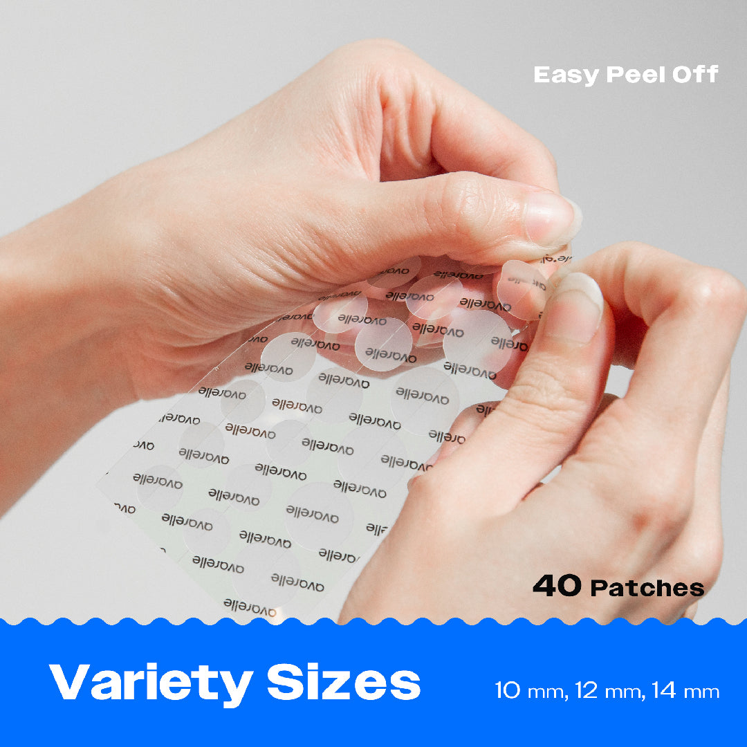A person peeling off an Avarelle ZitOut Original 40 pimple patch from a sheet with various sizes of patches.